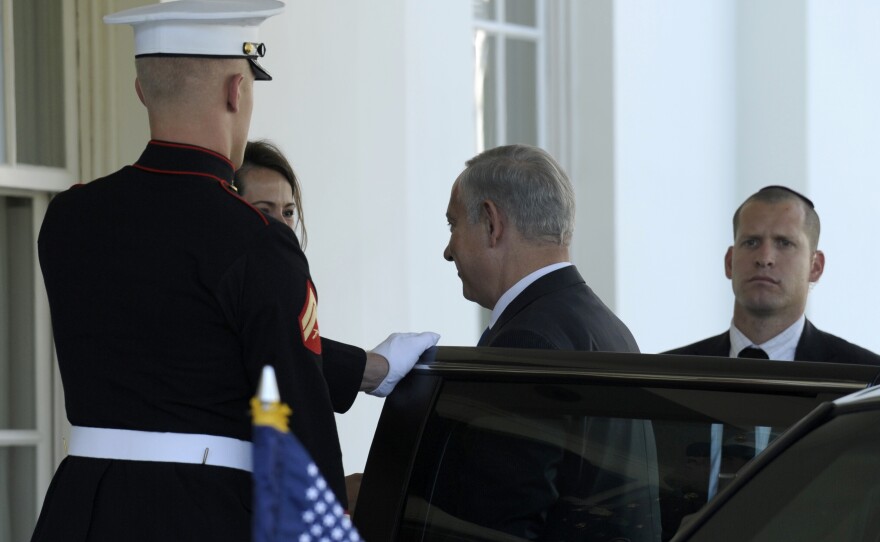 Israeli Prime Minister Benjamin Netanyahu arrives Monday at the White House to meet with President Obama. The two are expected to discuss Iran's nuclear program, Syria's civil war, and peace negotiations with the Palestinians.