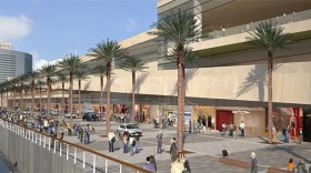 An artist's rendering illustrates the plans for expanding the Convention Center, including a five-acre rooftop park.