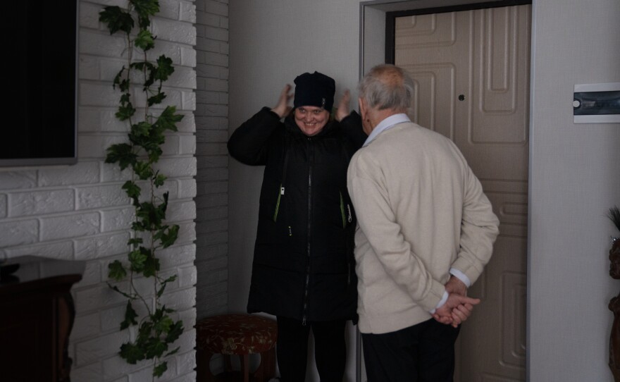 Svitlana Domoratska, a social worker in Sloviansk, leaves Viktor and Liubov Lada after her visit.