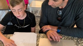 Tristan McCoy, right, sits next to his son, Mason McCoy at their Rancho Bernardo home, March 20, 2021.