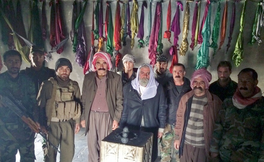 The stone pillar at the center of this temple is where Yazidi worshippers bring their prayers. "During the siege, we came here every day and asked God to save us," says a fighter named Shamwa Edo.