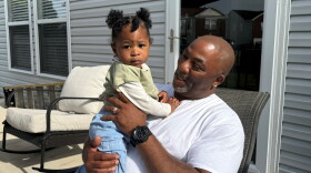 Anthony Bailey, 61, holds one of his grandchildren in this May 2025 photo.