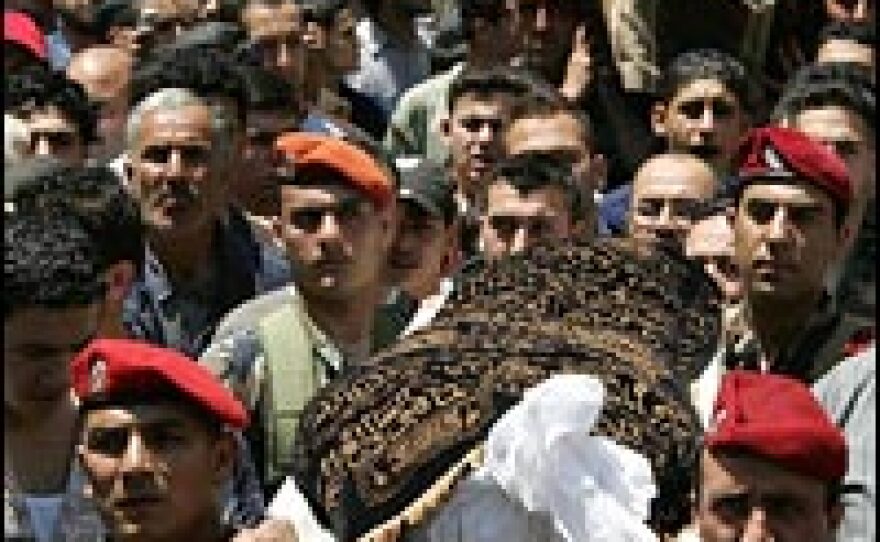 Lebanese soldiers in a May 21 funeral procession carry the bodies of troops killed in fighting in Tripoli.