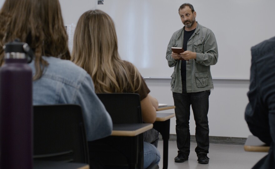 Ron Najor as Amer in the classroom of "Adjunct," a film he also wrote and directed. (2025)