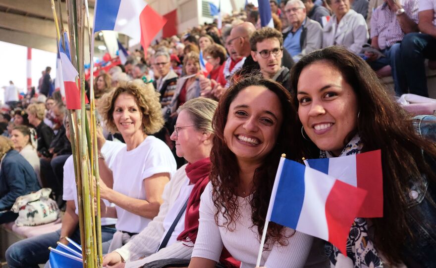People wave French national flags during the last meeting of the loyalists for the "NO" to the self-determination referendum of New Caledonia, in Noumea on October 1, 2020.