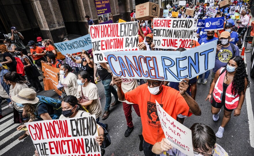 Housing activists march across town towards the office of New York Gov. Kathy Hochul. The state recently pledged to spend $800 million of its pandemic relief money on rental assistance.