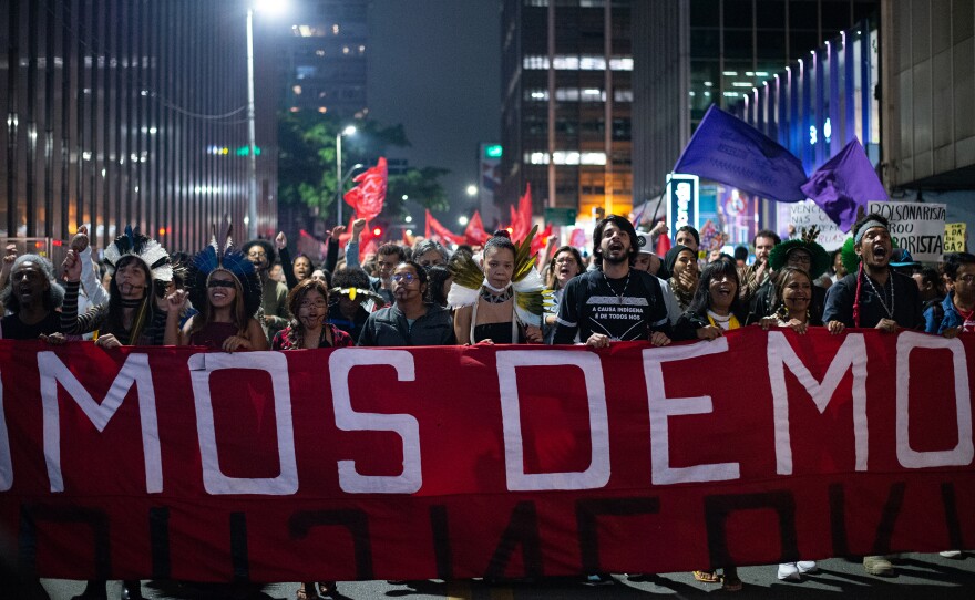 Protesters march in response to Sunday's assault in the capital Brasília and in defense of democracy on the Augusta Street in São Paulo, Brazil, on Monday.