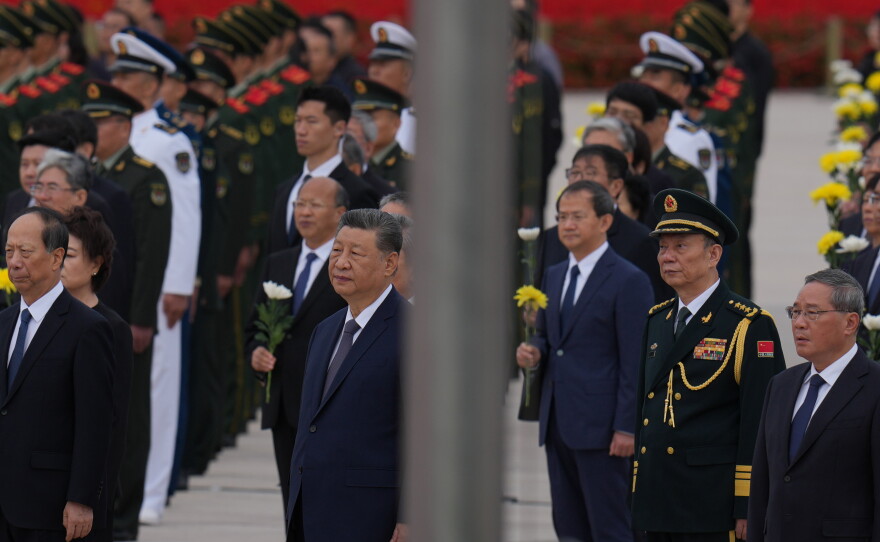 Chinese President Xi Jinping, center left and Zhang Shengmin, Vice Chairman of the Central Military Commission second from right attend a ceremony in honor of fallen national heroes at the Monument to the People's Heroes to mark Martyrs' Day at Tiananmen Square in Beijing, Wednesday, Sept. 30, 2026.