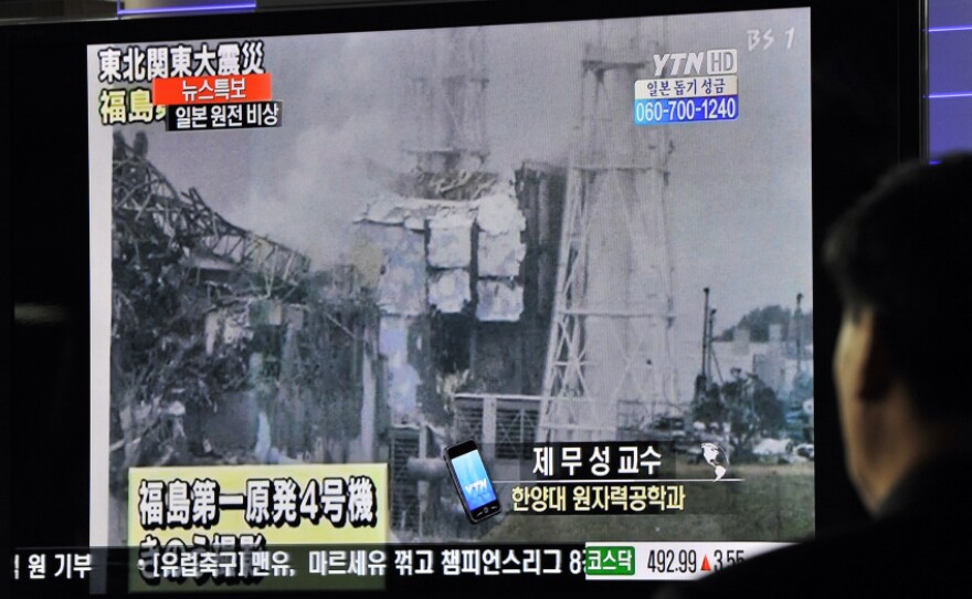 South Korean passengers watch a broadcast of the situation at the Fukushima Dai-ichi nuclear plant from a train station. There have been no major changes to the situation at the nuclear power plant in a few days.