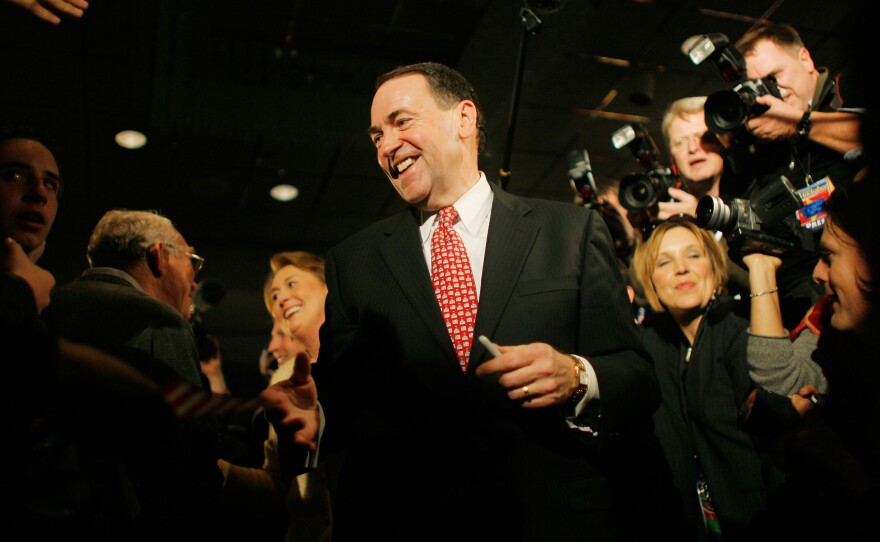 Huckabee greets supporters ahead of his victory in the 2008 Iowa caucus.