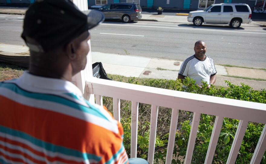 Eric Perkins (right) says he lived on the beach, then a shelter and then in a hotel during the pandemic before moving into the Norfolk apartment. The median local rent for a one-bedroom apartment is over $1,000. Perkins' rent is $600.