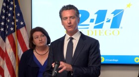 Governor Gavin Newsom speaks at 211 San Diego, while standing in front of state Senator Toni Atkins on Friday August 9, 2019.