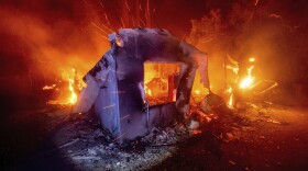 Flames from the LNU Lightning Complex fires consume a home in unincorporated Napa County, Calif., on Wednesday, Aug. 19, 2020.