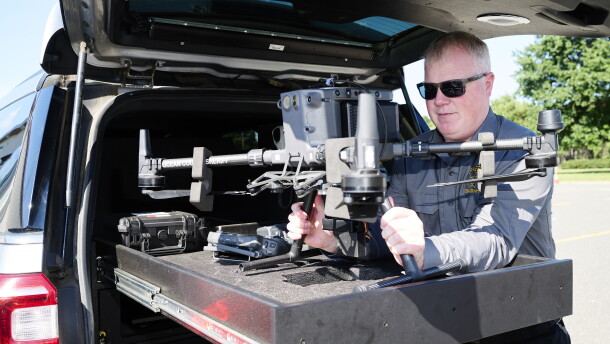 Chief Warrant Officer Kevin Fennessy lifts an Ocean County Sheriff's Office DJI Matrice 300 RTK drone out of the custom-built bed of a department SUV at Robert J. Miller Airpark on Sept. 4.