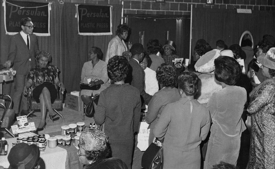 Persulan representatives hosting product demonstrations for hairstylists at the Bronner Beauty Show in 1965.