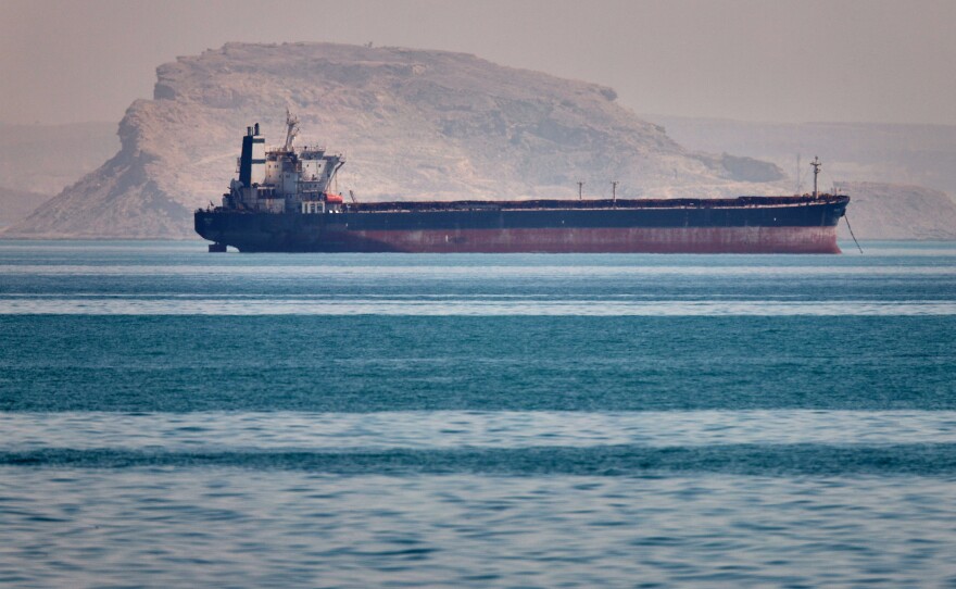 A bulk cargo ship sits at anchor in the Strait of Hormuz off Bandar Abbas, Iran, Saturday, May 2, 2026.