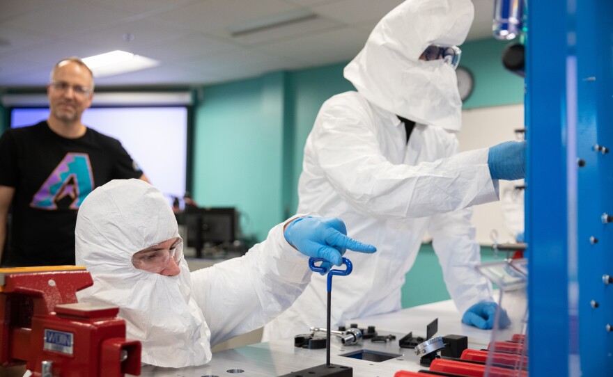 Brad Gist, 30, works with Liam Levinson, 28, during a lab for a 10-day semiconductor course at Chandler Gilbert Community College in Mesa, Ariz., on Oct. 11, 2023.