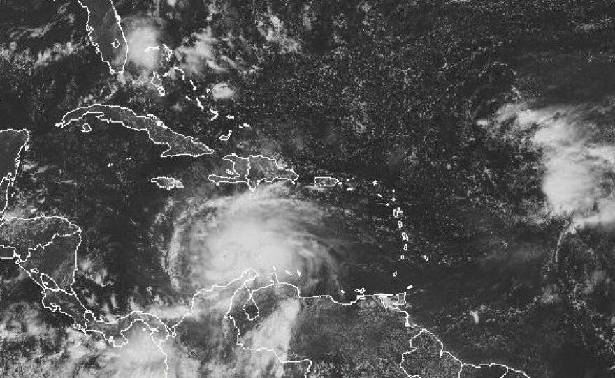 A satellite image shows Hurricane Matthew's location around midday Saturday. The storm is expected to move to the north and northwest.