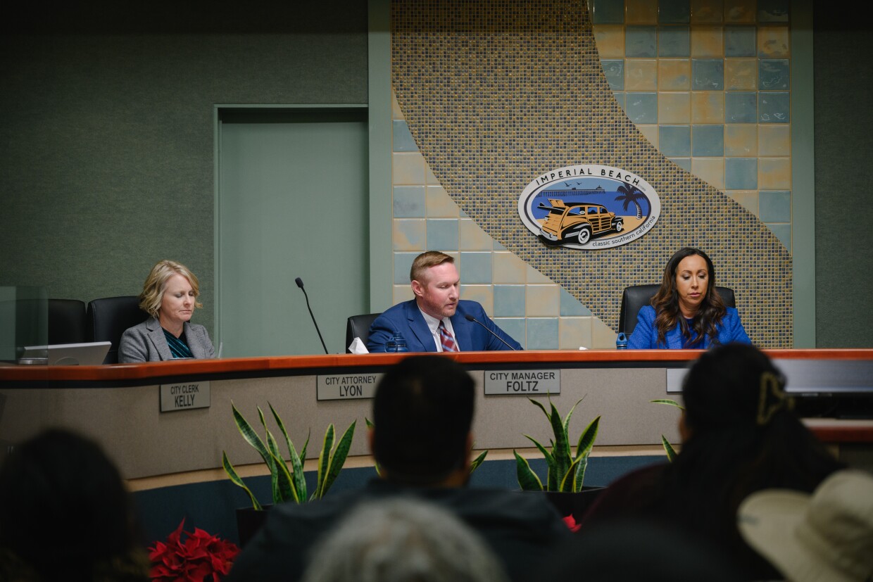 Brenda Bautista and Robert Lucas, tenants at The Swell apartment complex, stand for a portrait outside Imperial Beach City Hall in Imperial Beach, California on January 15, 2024. Bautista and Lucas received an eviction notice in early January, after months of advocating for stronger tenant protections.