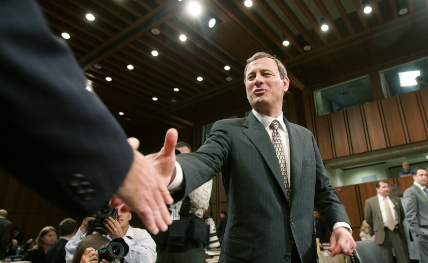 Supreme Court nominee John Roberts shakes Sen. Chuck Schumer's hand at Roberts' confirmation hearing in September 2005.