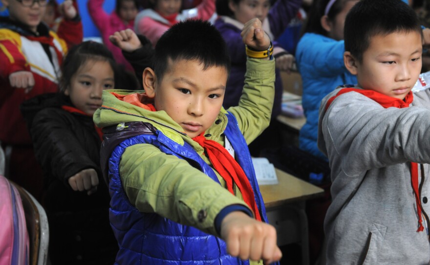 China is one of the countries where childhood mortality is dropping. Above, students practice martial arts.