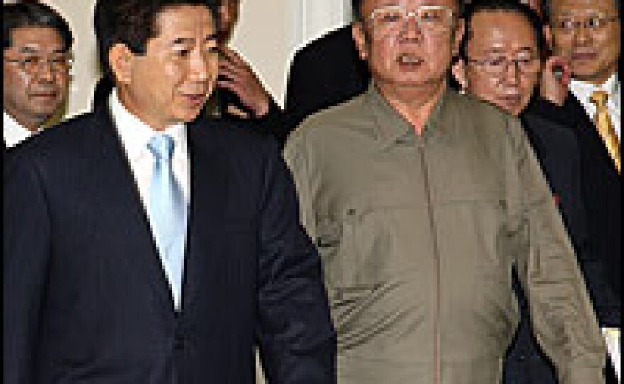 South Korean President Roh Moo-hyun (left) and North Korean Leader Kim Jong-Il meet in Pyongyang, North Korea. Roh and Kim are holding a three-day summit aimed at ending the half-century of animosity between the two countries.