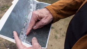 Varadero resident Kip McBane points to satellite imagery of the property line between Citizens Development and Varadero on March 20, 2018. At least one structure crosses that line.