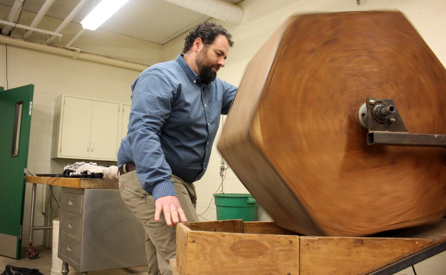 Joseph Coombs, a researcher at Michigan State University, tumbles potatoes during a "bruise test."