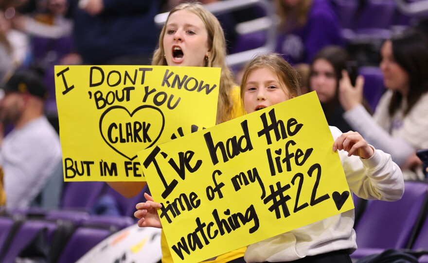 Young fans hold signs for Caitlin Clark prior to the game against the Northwestern Wildcats on Jan. 31, in Evanston, Ill.