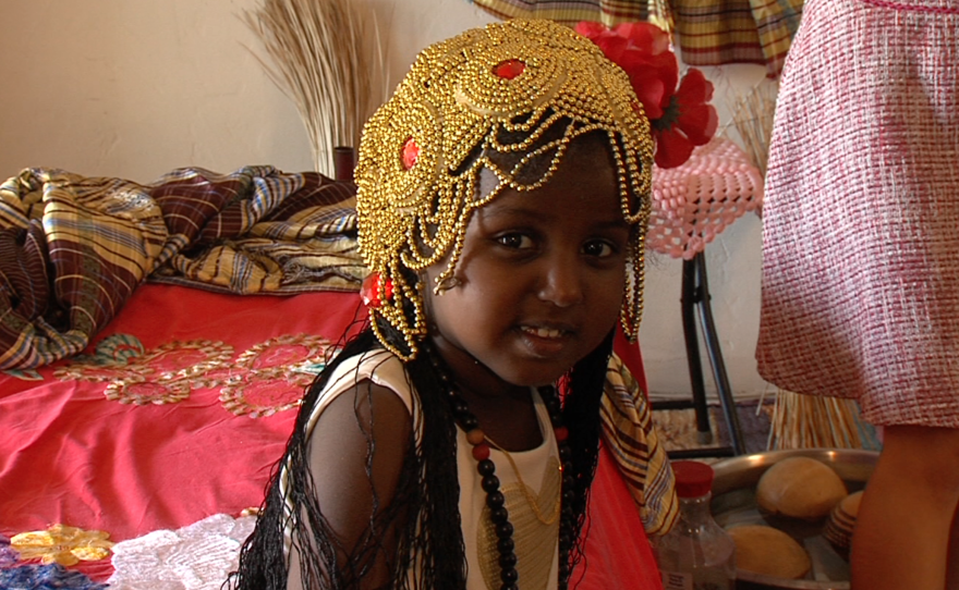 Maha Hussein's daughter, Sagal, wears a crown typical of a Sudanese genital mutilation ritual, Aug. 2, 2016.