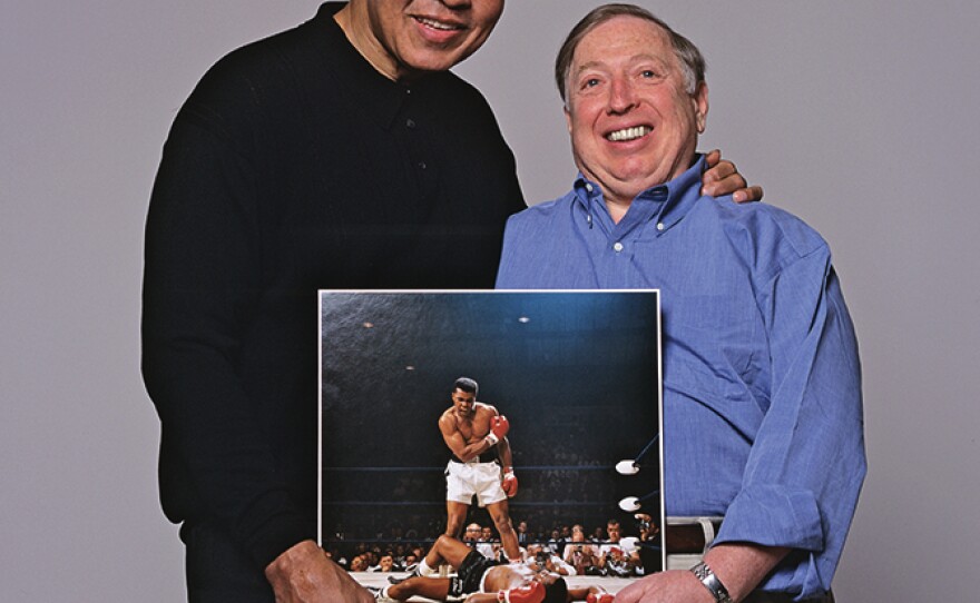 Years later, Muhammad Ali and Leifer hold the iconic <a href="http://neilleifer.com/portfolio/muhammad-ali-vs-sonny-liston-1965-world-heavyweight-title-2/">Ali-Liston photograph</a> from 1965. Photo from <em>Relentless: The Stories behind the Photographs,</em> by Neil Leifer with Diane K. Shah (University of Texas Press, 2016)