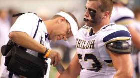 Samuel Harvill from Shiloh Christian High School gets his elbow taped during a game against the Euless Trinity Trojans at Cowboys Stadium in Dallas in 2010.