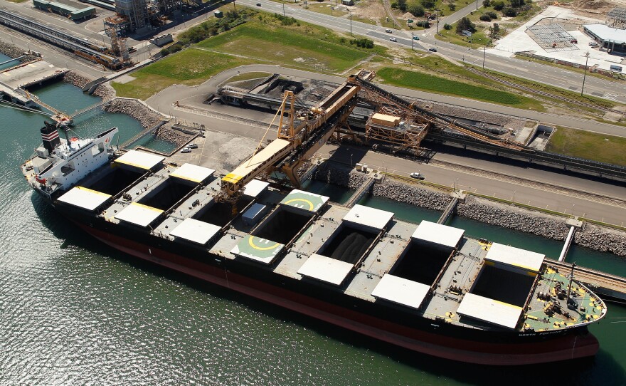 A bulk carrier is loaded with coal at the Newcastle Coal Terminal in this aerial photograph taken in Newcastle, Australia in 2015.