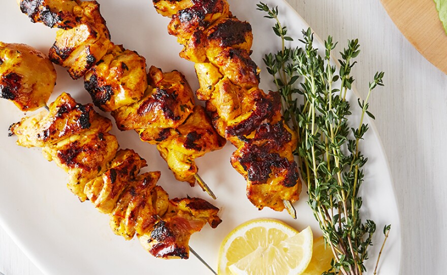 Pictured: Saffron-yogurt chicken kebabs. Kebabs are skewered meats cooked on the grill. Martha Stewart gets creative as she threads flavor-packed ingredients onto each skewer. 