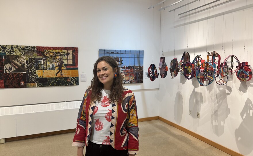 Katrina Bruins, executive director of the Visions Museum of Textile Art, stands in the gallery space on Dec. 4, 2025.