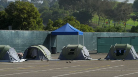 Four occupied tents provided by the city of San Diego at the safe sleeping site on the City Operations Yard at 20th and B in Golden Hill, CA on July 5, 2023. 