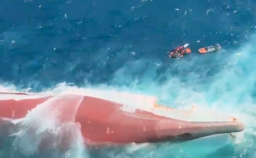 In this aerial image taken from video released by Indonesia's National Search and Rescue Agency (BASARNAS), the bottom of passenger ferry Virgo Transport 8 is seen above the water after it overturned in bad weather in the Java Sea, Sunday, Sept. 13, 2026.