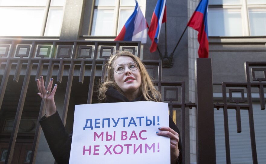 Russian TV host and presidential candidate Ksenia Sobchak pickets against sexual harassment with Amnesty International.