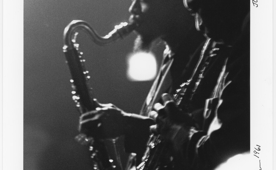 A photograph of Eric Dolphy (left) and John Coltrane taken by Herb Snitzer during a performance at the Village Gate in New York in 1961.