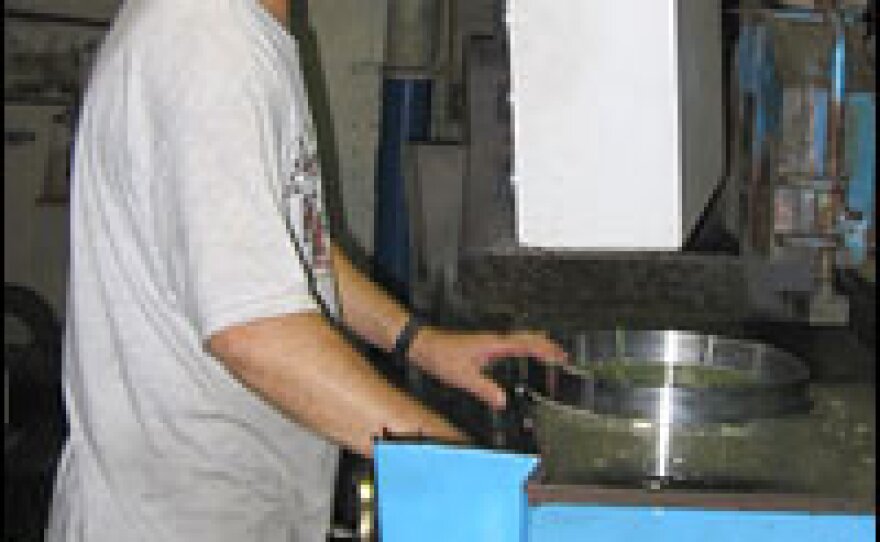 A machinist cuts steel at TechShop in San Jose. The factory, which makes custom parts for the aerospace industry, depends on a steady supply of electricity.