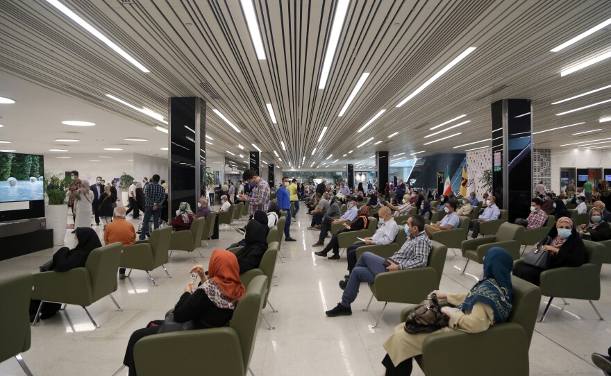 People ages 70 and over wait to get vaccinated against COVID-19 at an allocated section of the Tehran Shopping Center on May 25. General vaccinations started on Feb. 9 in Iran continued with vaccines from Russia and China and some through the global COVAX network. Now Iran has given emergency authorization for a domestically produced vaccine.