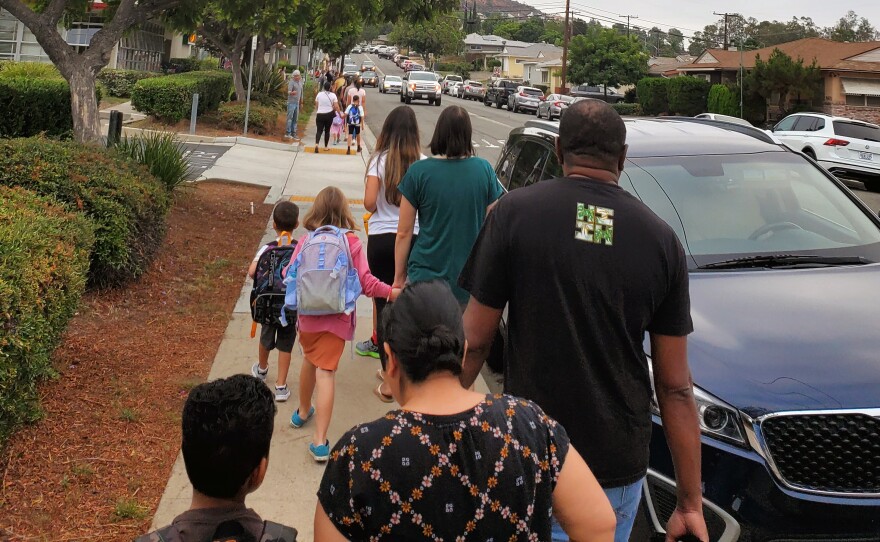 Parents and kids walk to Marvin Elementary School in Allied Gardens on the first day of school, Aug. 29, 2022.