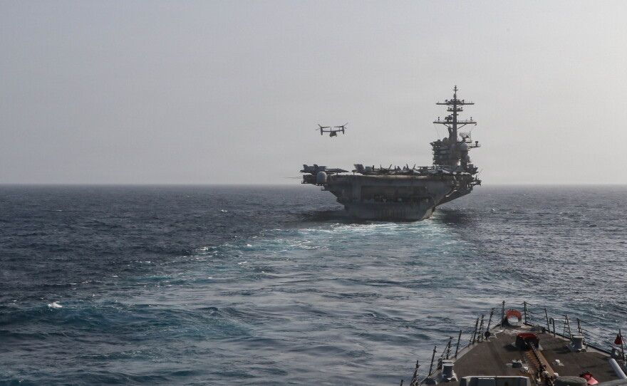 Arleigh Burke-class guided-missile destroyer USS Frank E. Petersen Jr. (DDG 121) sails behind the Nimitz-class aircraft carrier USS Abraham Lincoln (CVN 72), June 27, 2026. Frank E. Petersen Jr. is deployed to the U.S. 5th Fleet area of operations to support maritime security and stability in the Middle East.