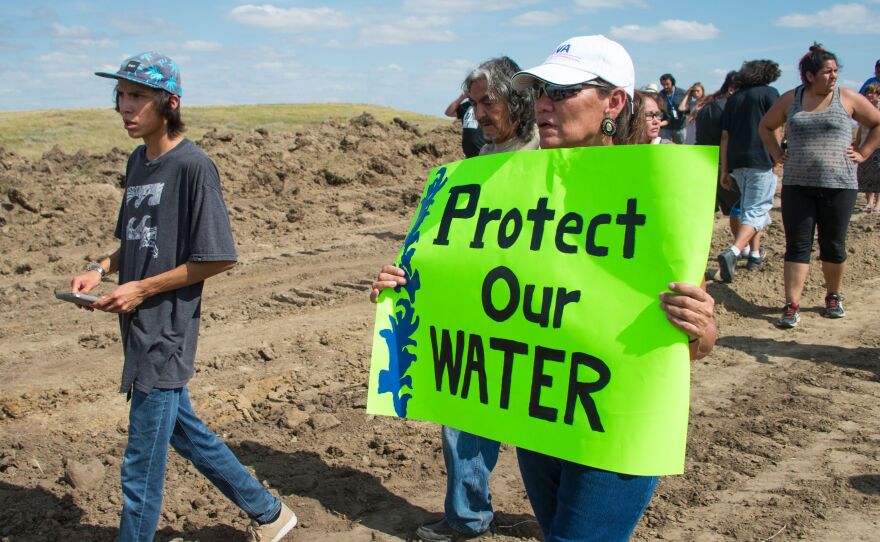 A protestor is treated after being pepper sprayed by private security contractors on land being graded for the Dakota Access Pipeline near Cannon Ball, N.D., Sept. 3, 2016.