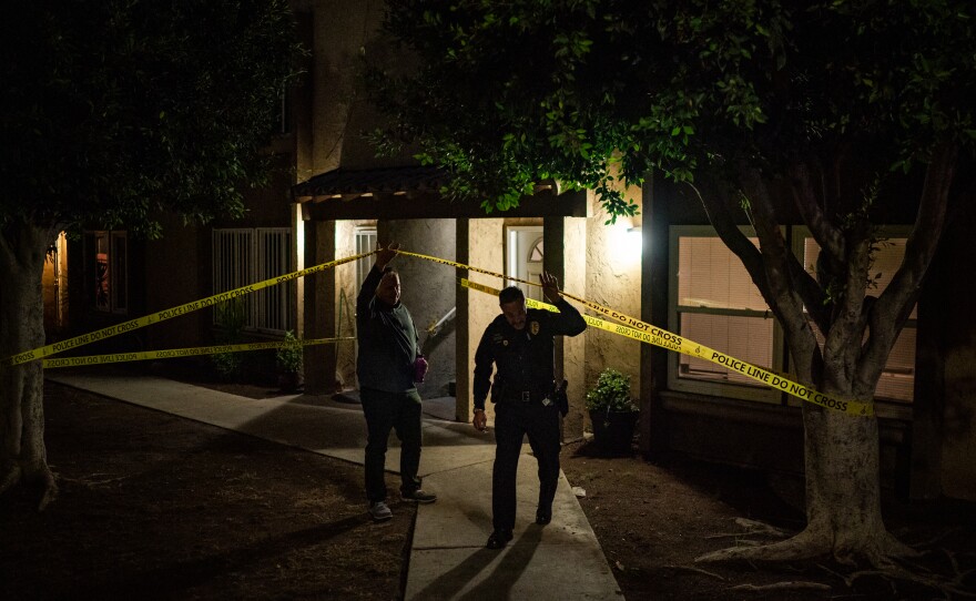 Ed Byrne, Homeland Security investigations agent, left, and Lt. Ken Impellizeri of the San Diego Police leave the scene of a fatal fentanyl overdose by a 39-year-old woman in San Diego, Calif., on Nov. 10.