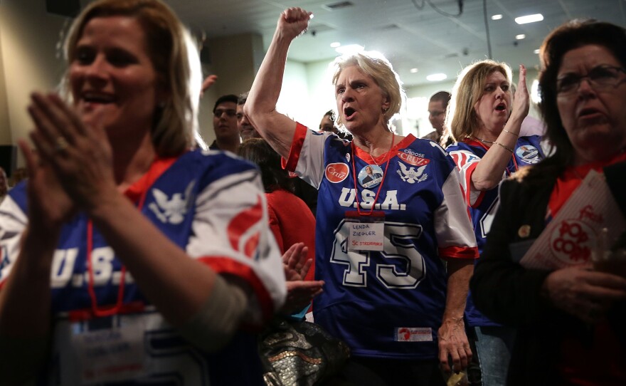 Supporters of Republican presidential candidate Ted Cruz cheer during a primary night party at the South Carolina State Fairgrounds in Columbia, South Carolina.
