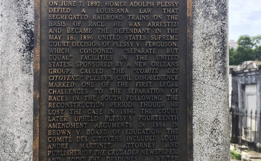 This June 3, 2018 photo shows a marker on the burial site for Homer Plessy at St. Louis No. 1 Cemetery in New Orleans.