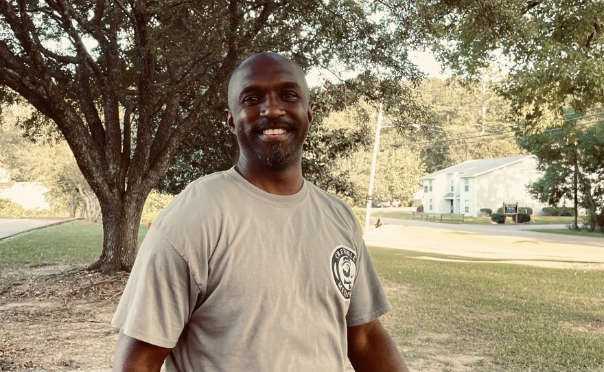Jason Page is a youth mentor with the group Strong Arms. He helps distribute water at the Sykes Community Center.