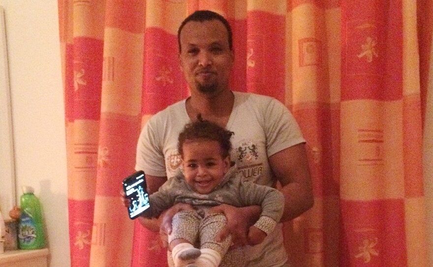Born in Malta, Lucky (shown here with her father, Hussein Mohamed Abdi) was given that name by her mother because she survived the trip from Africa to Europe. Her mother was pregnant and at sea for six days. Several in her boat did not survive the journey.