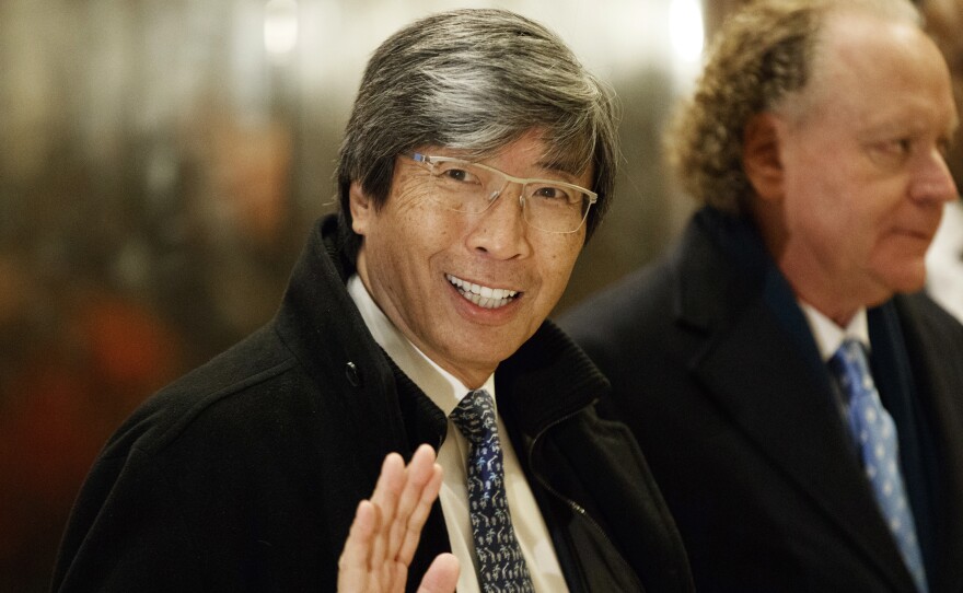 In this Jan. 10, 2017, file photo, pharmaceuticals billionaire Dr. Patrick Soon-Shiong waves as he arrives in the lobby of Trump Tower in New York for a meeting with President-elect Donald Trump. Soon-Shiong will take over the L.A. Times on Monday.